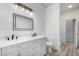 Modern bathroom with double vanity, a large mirror, and toilet at 6903 W Irwin Ave, Laveen, AZ 85339
