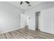 Bedroom with laminate wood floors, and sliding closet doors at 6903 W Irwin Ave, Laveen, AZ 85339