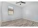 Spacious bedroom with laminate flooring and a ceiling fan at 6903 W Irwin Ave, Laveen, AZ 85339