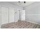 Bedroom with double door closet and wood-look floors at 6903 W Irwin Ave, Laveen, AZ 85339