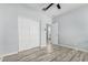 Bright bedroom with double doors leading to a bathroom and closet at 6903 W Irwin Ave, Laveen, AZ 85339
