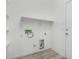 Laundry room with shelving and hookups for washer and dryer at 6903 W Irwin Ave, Laveen, AZ 85339