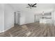 Open concept living room with kitchen views and hardwood floors at 6903 W Irwin Ave, Laveen, AZ 85339