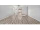 Bright living room featuring hardwood floors and access to a patio at 6903 W Irwin Ave, Laveen, AZ 85339