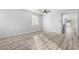 Living room with hardwood floors and views to the kitchen at 6903 W Irwin Ave, Laveen, AZ 85339