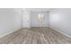 Living room with hardwood floors and a window at 6903 W Irwin Ave, Laveen, AZ 85339