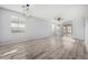 Spacious living room with hardwood floors and sliding glass doors at 6903 W Irwin Ave, Laveen, AZ 85339