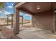 Covered patio with pergola and a small table and benches at 6903 W Irwin Ave, Laveen, AZ 85339