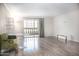 Comfortable living room with a relaxing view, and sliding glass door access to a balcony at 7970 E Camelback Rd # 101, Scottsdale, AZ 85251