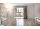 Inviting balcony with open view, accessed by sliding glass doors, and featuring wood-style flooring at 7970 E Camelback Rd # 101, Scottsdale, AZ 85251