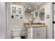 Updated bathroom with granite countertop and large mirror at 7970 E Camelback Rd # 101, Scottsdale, AZ 85251