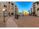 Paved pathway winds through the community, offering a pleasant stroll among buildings at 7970 E Camelback Rd # 101, Scottsdale, AZ 85251