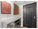Bright entryway with contemporary console table and art at 7970 E Camelback Rd # 101, Scottsdale, AZ 85251