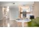 A bright kitchen featuring stainless appliances, white cabinetry, and modern decorative backsplash at 7970 E Camelback Rd # 101, Scottsdale, AZ 85251
