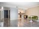Open living room featuring wood floors, modern décor and an open concept to the kitchen at 7970 E Camelback Rd # 101, Scottsdale, AZ 85251