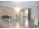 Bright living room with wood floors, modern decor, and sliding glass doors leading to a balcony at 7970 E Camelback Rd # 101, Scottsdale, AZ 85251