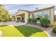 Landscaped backyard showcasing a pool and lush green lawn at 1342 E Verde Blvd, Queen Creek, AZ 85140