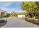 Spacious backyard oasis with a water feature, lush landscaping, and a lemon tree at 1342 E Verde Blvd, Queen Creek, AZ 85140