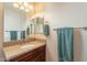 Neat bathroom boasting a vanity with granite countertop and modern fixtures at 1342 E Verde Blvd, Queen Creek, AZ 85140