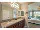 Double sink bathroom vanity with granite countertop at 1342 E Verde Blvd, Queen Creek, AZ 85140