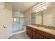 Elegant bathroom with double vanity and walk-in shower at 1342 E Verde Blvd, Queen Creek, AZ 85140