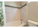 Clean bathroom with a bathtub, shower, and stylish tilework at 1342 E Verde Blvd, Queen Creek, AZ 85140