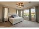 Bright bedroom with large windows and plush carpet at 1342 E Verde Blvd, Queen Creek, AZ 85140