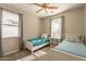 Bright bedroom with twin beds, ceiling fan, and ample natural light at 1342 E Verde Blvd, Queen Creek, AZ 85140