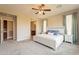 Spacious Primary bedroom with ensuite access and ceiling fan at 1342 E Verde Blvd, Queen Creek, AZ 85140