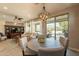 Casual dining area with a round table and four chairs, and view to backyard at 1342 E Verde Blvd, Queen Creek, AZ 85140