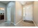 Bright and airy entryway with tile floors and access to a bathroom at 1342 E Verde Blvd, Queen Creek, AZ 85140