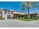 Community clubhouse with stone accents and palm trees at 1342 E Verde Blvd, Queen Creek, AZ 85140