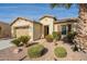 House exterior showcasing a two-car garage and desert landscaping at 1342 E Verde Blvd, Queen Creek, AZ 85140