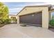 Attached garage with a retractable sunshade for added protection at 1342 E Verde Blvd, Queen Creek, AZ 85140