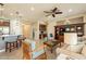 Bright living room with comfortable seating, built-in shelving, and ceiling fan at 1342 E Verde Blvd, Queen Creek, AZ 85140