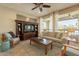 Living room features a neutral color palette, comfortable seating, and built-in entertainment center at 1342 E Verde Blvd, Queen Creek, AZ 85140