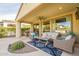 Relaxing covered patio with comfortable seating and a ceiling fan at 1342 E Verde Blvd, Queen Creek, AZ 85140