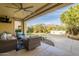 Covered patio with seating area, overlooking the backyard at 1342 E Verde Blvd, Queen Creek, AZ 85140