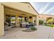 Inviting outdoor patio with seating area, ceiling fan, and built-in grill at 1342 E Verde Blvd, Queen Creek, AZ 85140