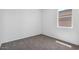 Bright, sunny bedroom featuring soft carpet and a sunny window at 1551 E Mason Dr, Casa Grande, AZ 85122