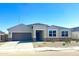 Charming single-story home featuring a two-car garage and stylish stone accents at 1551 E Mason Dr, Casa Grande, AZ 85122