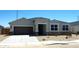 Charming single-Gathering home features a two-car garage, desert landscaping, and a covered entryway at 1551 E Mason Dr, Casa Grande, AZ 85122