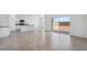 Open-concept living space with tile flooring that joins kitchen and sliding glass patio doors at 1551 E Mason Dr, Casa Grande, AZ 85122