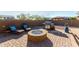 Relaxing backyard with fire pit and lounge chairs at 18865 W Mescal St, Surprise, AZ 85388