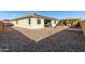 Large backyard with gravel area and patio at 18865 W Mescal St, Surprise, AZ 85388