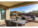 Outdoor oasis with a firepit, hot tub, and gazebo at 18865 W Mescal St, Surprise, AZ 85388