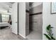 Modern bathroom with walk-in shower and gray tile at 18865 W Mescal St, Surprise, AZ 85388