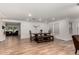 Bright dining area with modern paneling, a stylish table, and convenient access to the living room for entertaining at 19641 E Emperor Blvd, Queen Creek, AZ 85142
