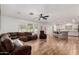 Spacious living room seamlessly connecting to an open kitchen, featuring modern flooring and ample natural light at 19641 E Emperor Blvd, Queen Creek, AZ 85142