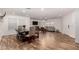 Open living space with wood-look floors, dining area, and comfortable seating arrangements creating a warm and inviting atmosphere at 19641 E Emperor Blvd, Queen Creek, AZ 85142